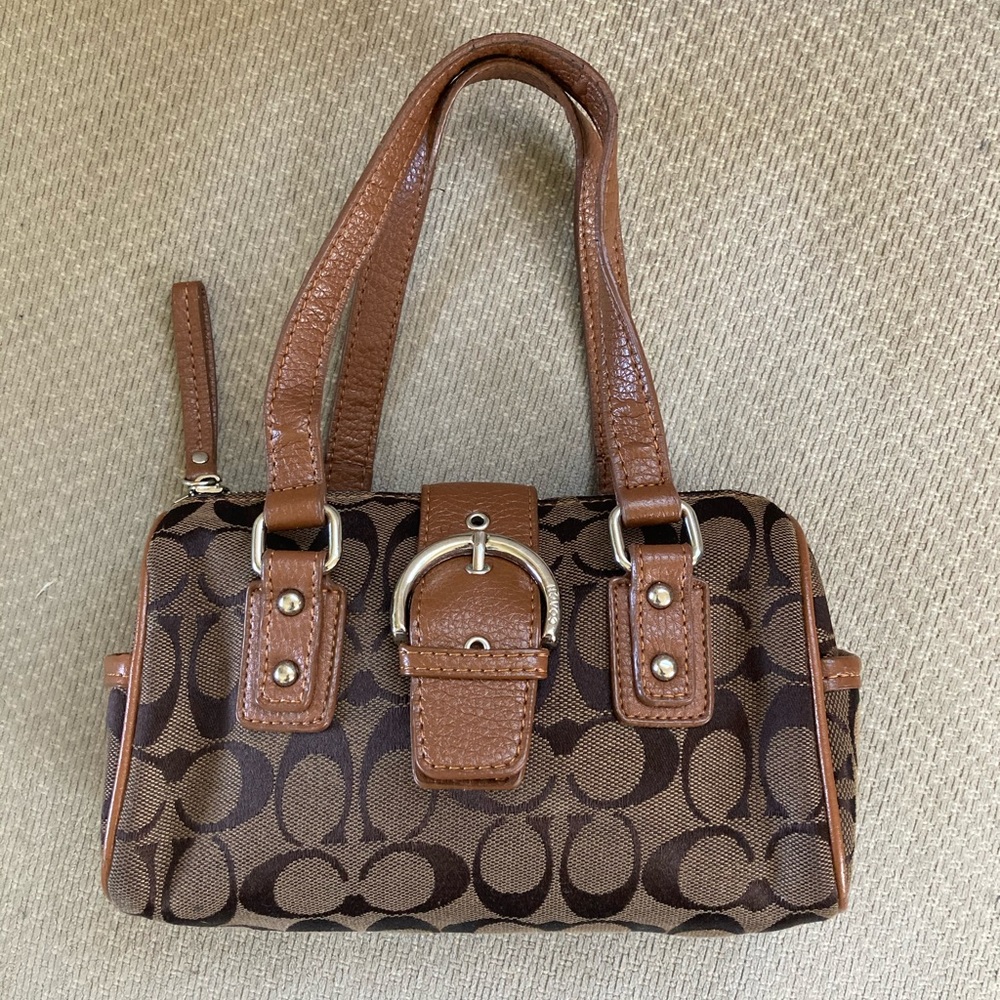Brown Coach clutch with magnetic snap